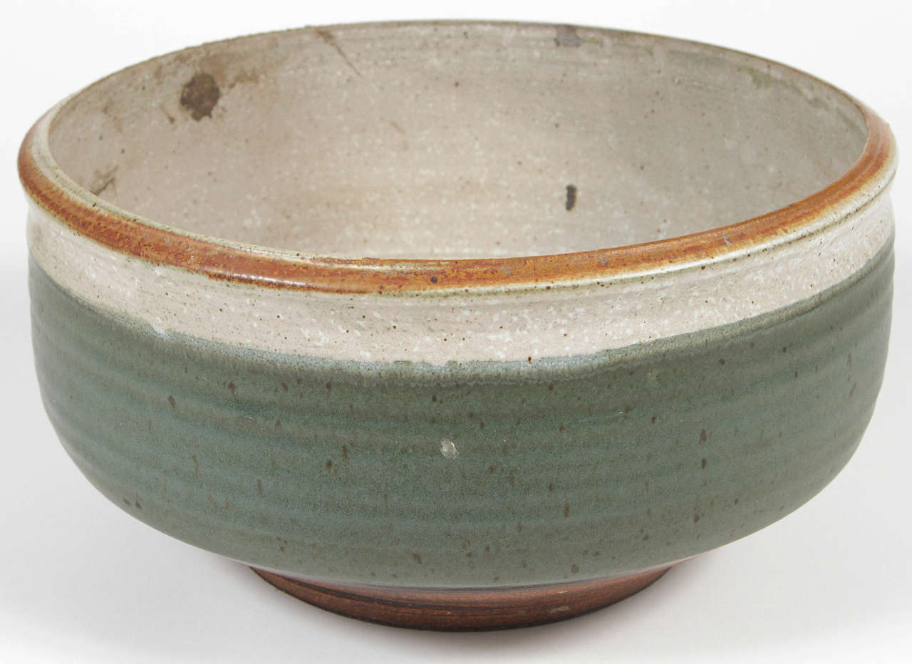 Limited production hand thrown planter by Raul Coronel for Architectural Pottery Craftsman One collection. A green glaze with white collar and unglazed lip.