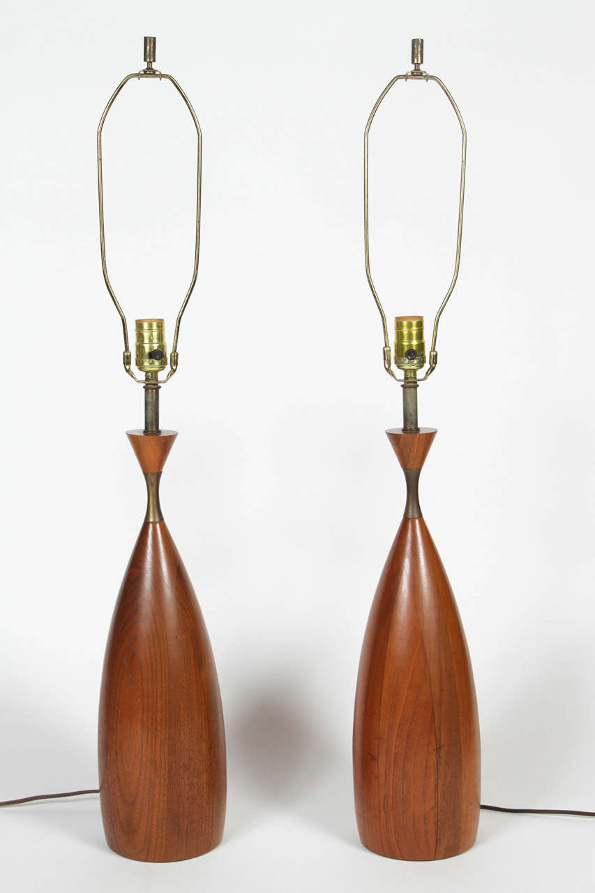 Pair of brass and wood table lamps by Tony Paul for Westwood Lighting, circa 1955.