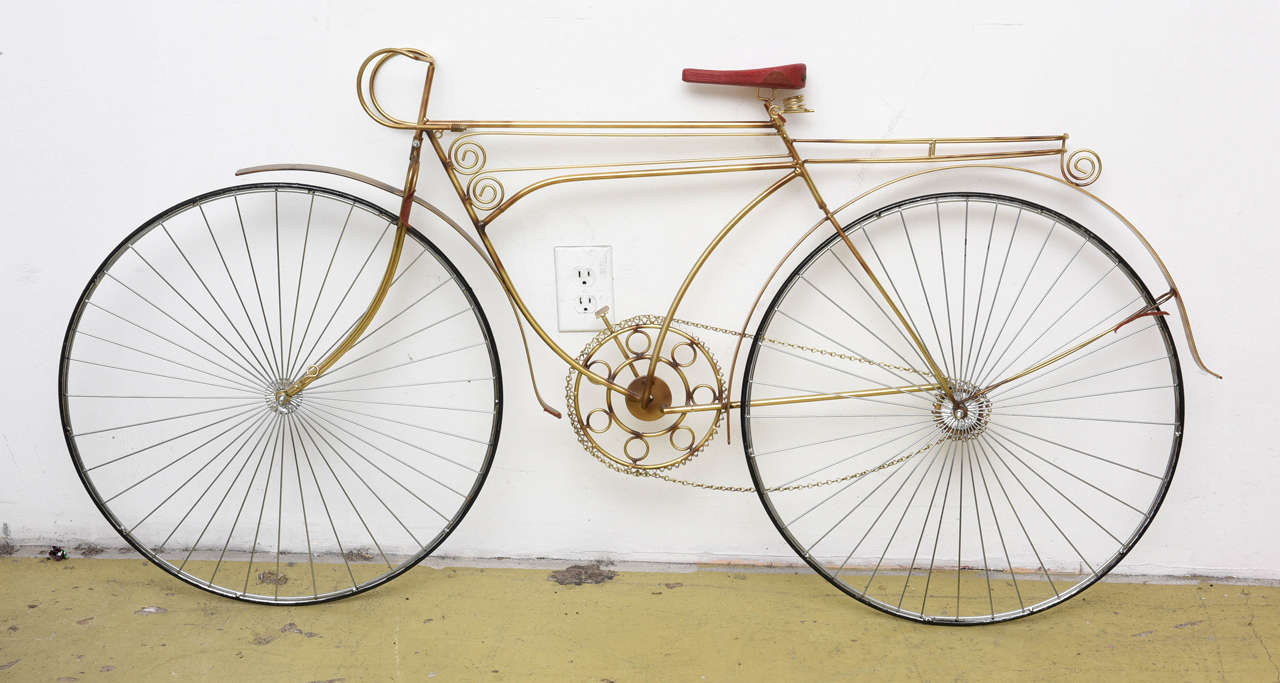 Life size metal wall sculpture of a bicycle by Curtis Jere.  Signed