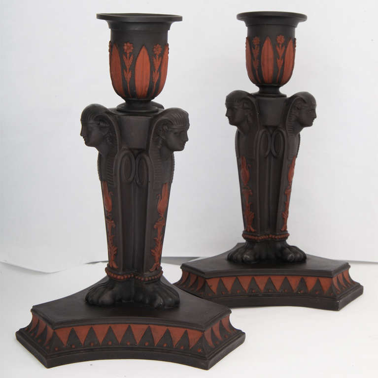 An important pair of Wedgwood Egyptian stlye candlesticks, basalt and terracotta, upper case mark