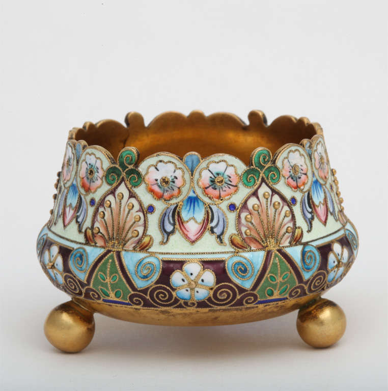 A fine Russian enamel on silver footed salt dish decorated in shaded enamels, signed 11A for the 11th Artel and 84 silver mark