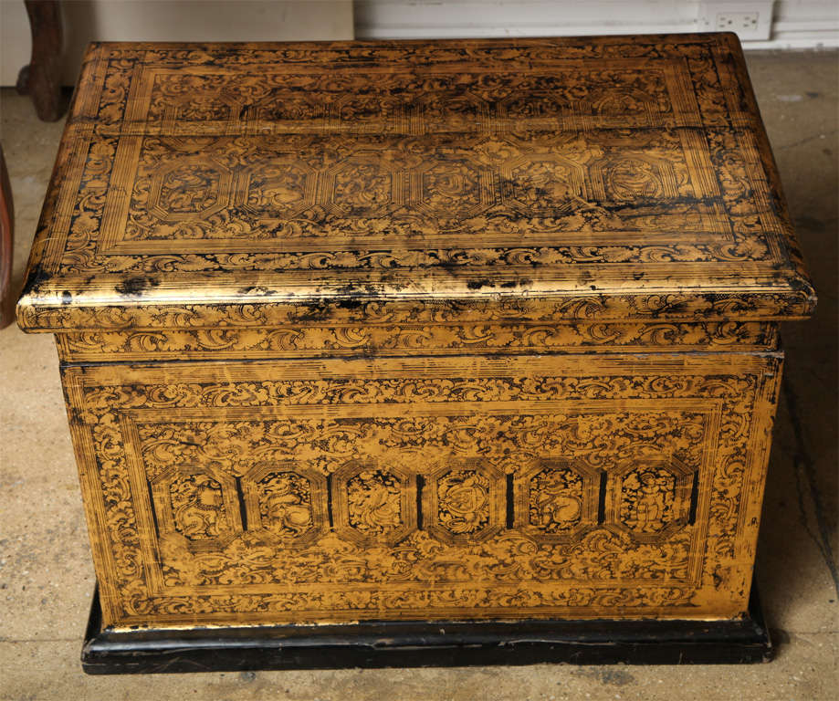 An artist's wooden chest with painted pictorial studies in gold on black. From Burma.