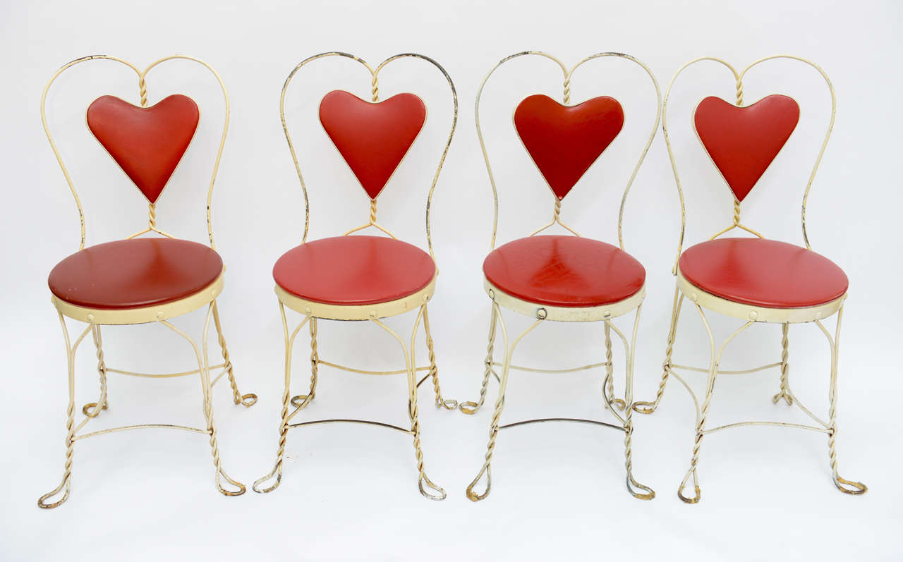 Set of 4 Antique Hard-to-Find White wrought iron Heart-Back twisted Dining Chairs. The distressed condition give the glamour.
 
