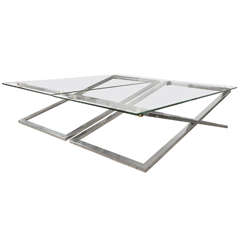 A Stylish  Pair Of Coffee Tables With X Chromed Steel Base
