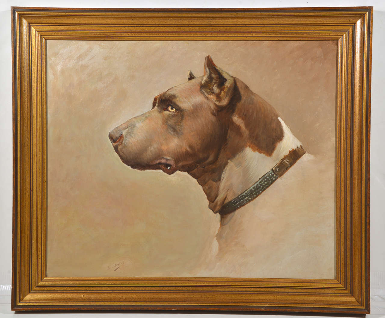 Framed oil on canvas painting of a dog side portrait, signed L. Batut