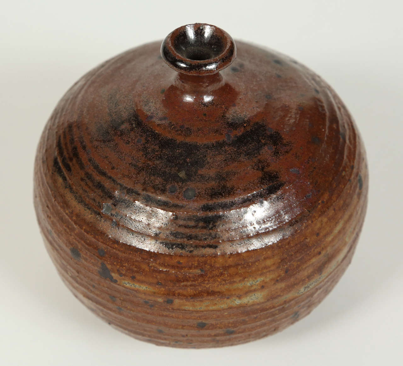 Small brown with black speckle design vintage vase.