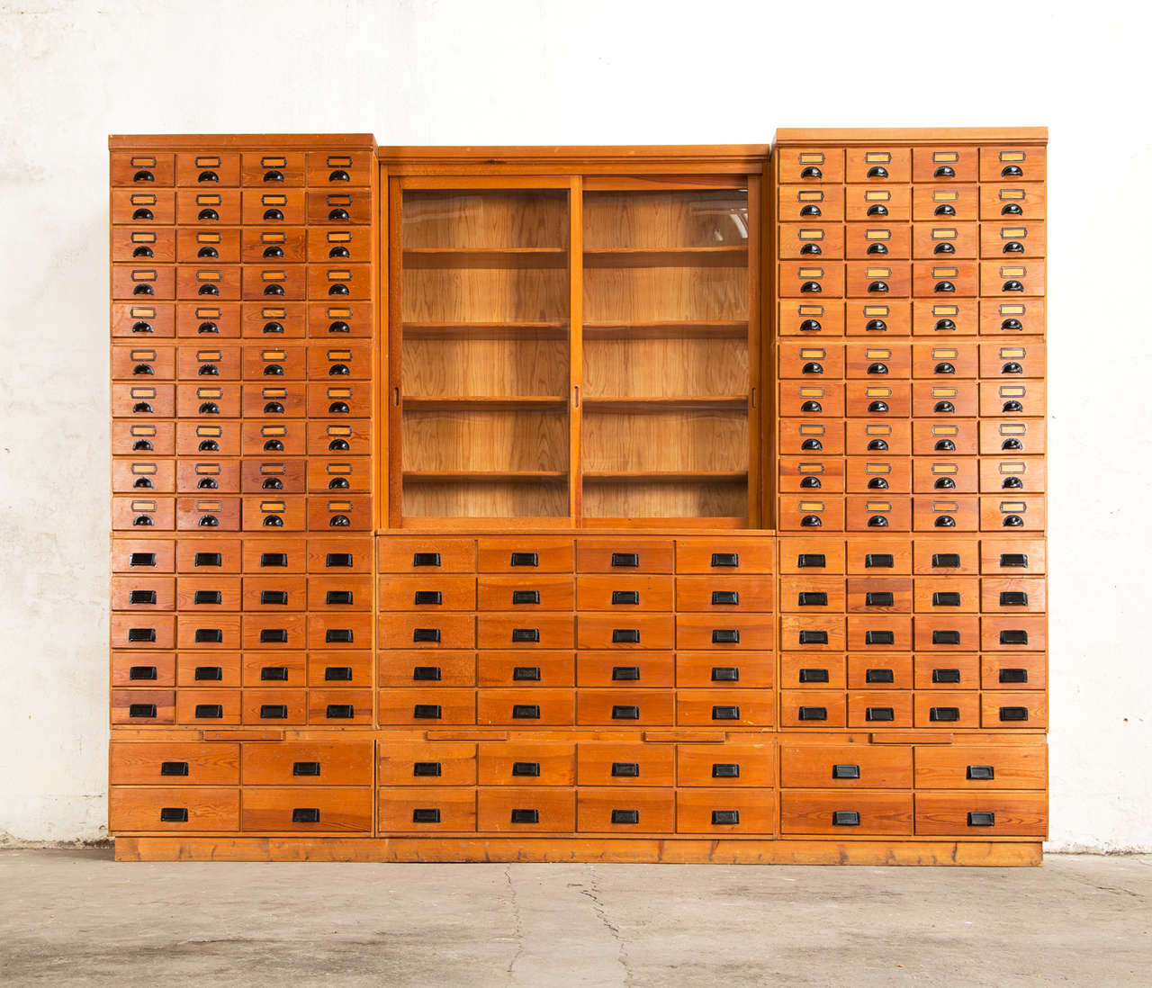 Cabinet, in wood, glass and metal, Denmark, 1950s.

Extreme large apothecary chest which counts a total of 156 drawers! This beautiful piece is made from redwood and is build up in eleven elements each divided with drawers in different sizes. One
