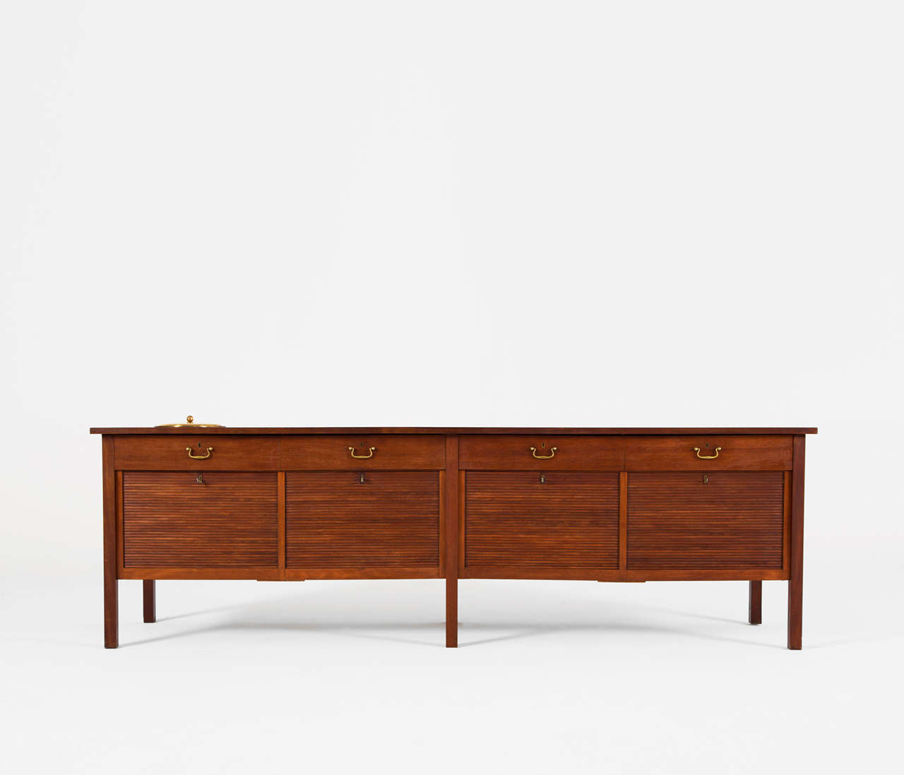 Rare cabinet by Preben Hansen, made by Cabinet maker Peter Petersen (1930's / 1940's) in teak, with 4 vertical tambour doors, and 4 drawers which are accommodate with nicely patented brass grips. The special feature of this credenza is the built in
