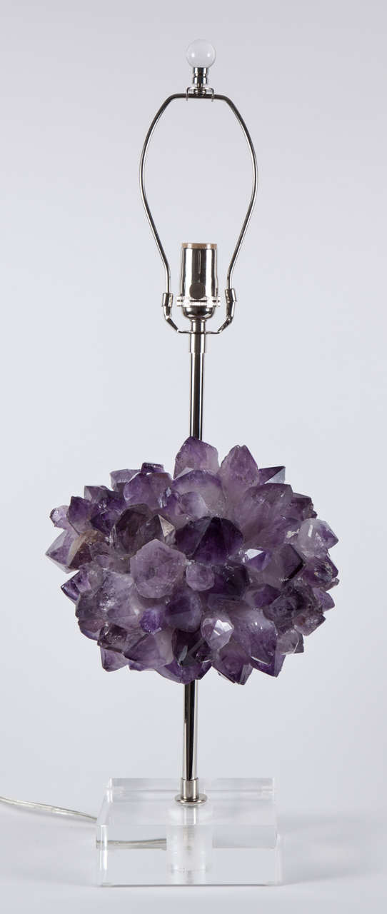 Pair of deep brilliant faceted  Amethyst crystal quartz encrusted sphere lamps on polished nickel stems and lucite bases. Quartz surrounds the center section making these spectacular from any vantage point.