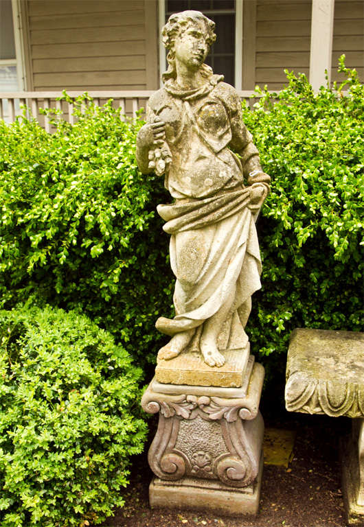This pair of beautifully-weathered carved limestone statues will add an instantaneous Old-World elegance to your garden. Surmounted on late 20th century 