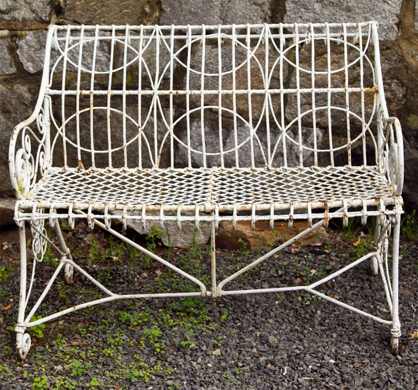 It is rare, indeed, when we find an all original and authentic wirework piece, particularly in this desirable small size. Made of reinforced braided wire encased in steel sleeves, and then paired with wrought iron arms, legs and supports, this