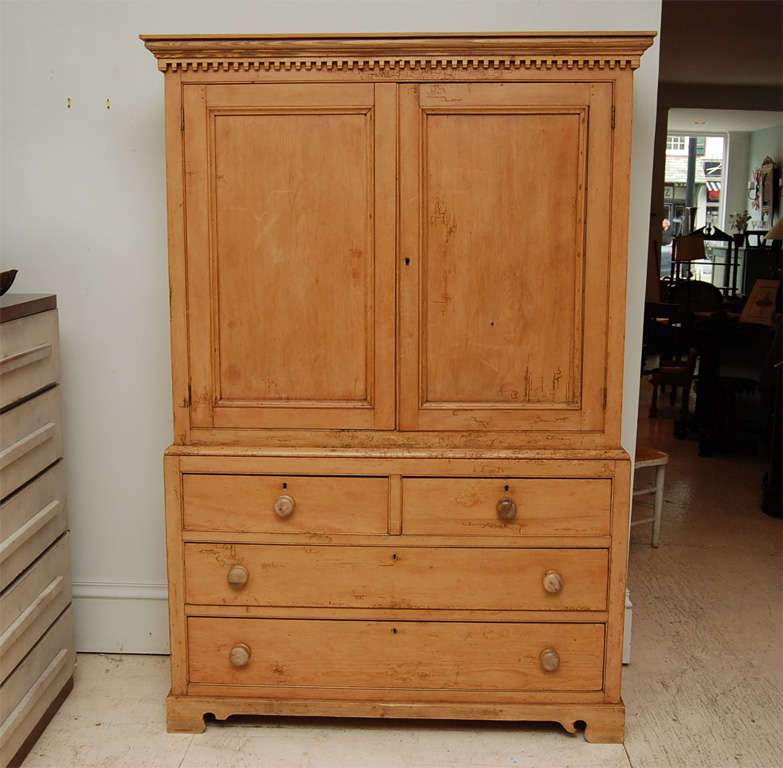 Beautiful pine English cabinet.  Cupboard over four drawers.  Cabinet outfitted for

television and electronic equipment.