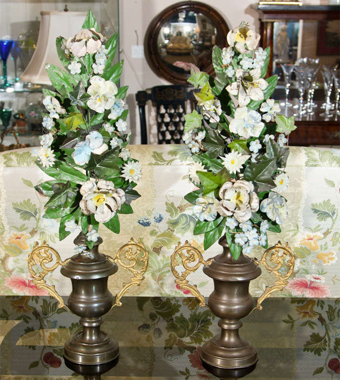 This unique pair of individual tole altar flower arrangements in urns would add sweet allurement to your home.