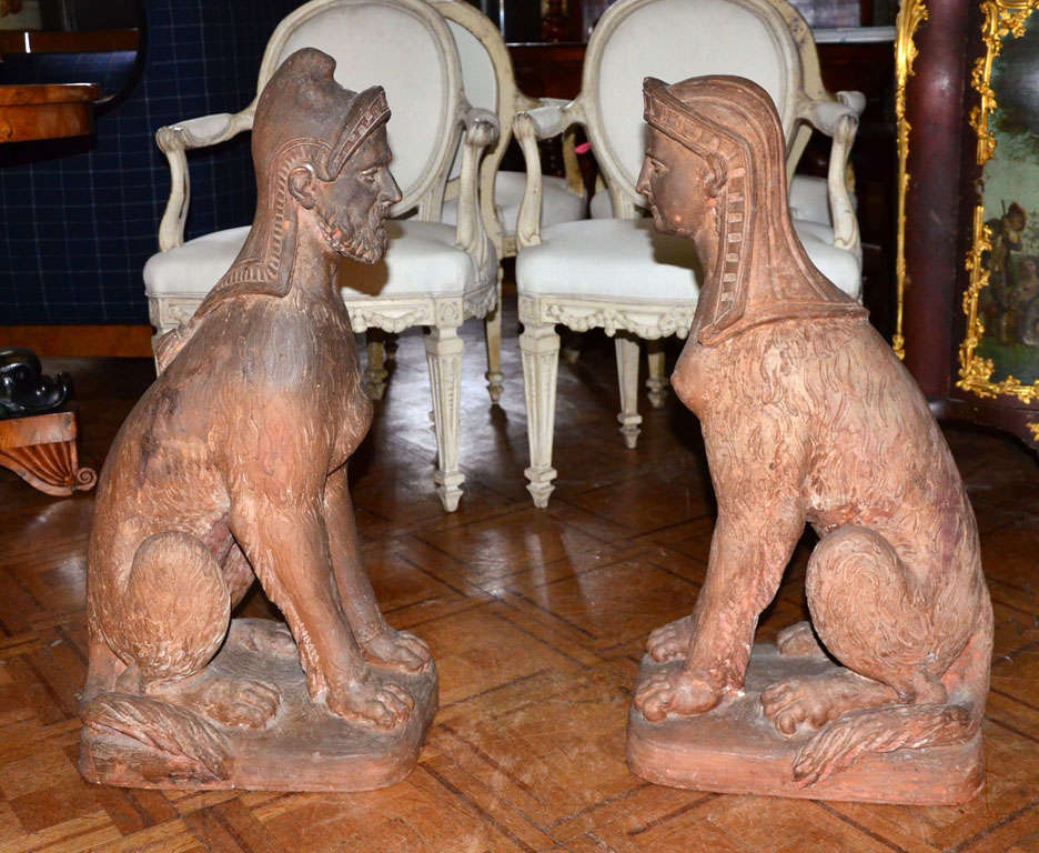 Pair of sphinxes with human head and wolf body. Egyptian style terracotta.

 First half of the nineteenth century