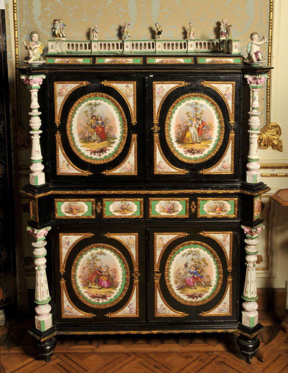 Cabinet with Meissen porcelain plaques, each plaque has the Meisson mark at the back and is surrounded with gilded bronze