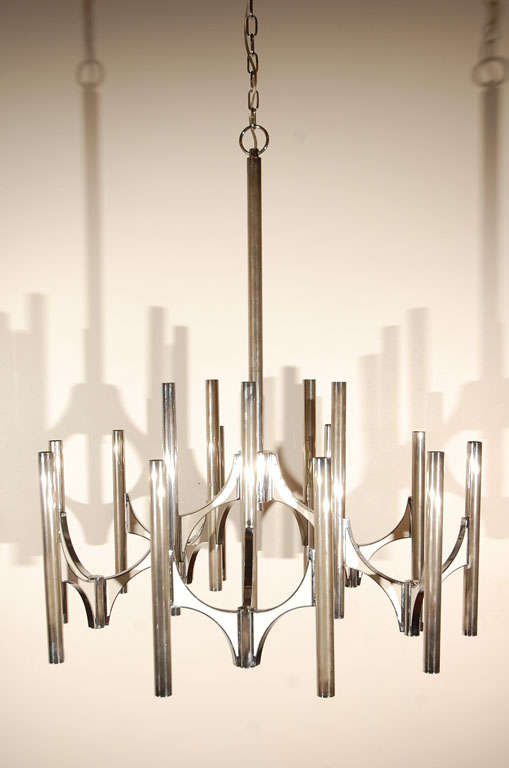 Five-arm chandelier (three lights on each arm) by Gaetano Sciolari. Chrome and white enamel. Signed. Pair of matching three-arm sconces available.