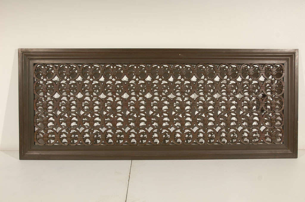 Large cast bronze architectural element with filigree detailing.