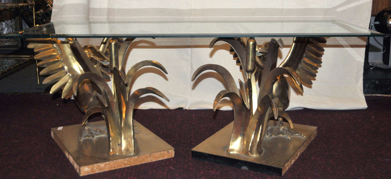 1970s coffee table with two separate bronze supports representing a bird with spread wings next to a plant; glass top. Signed by C. Téchoueyres.