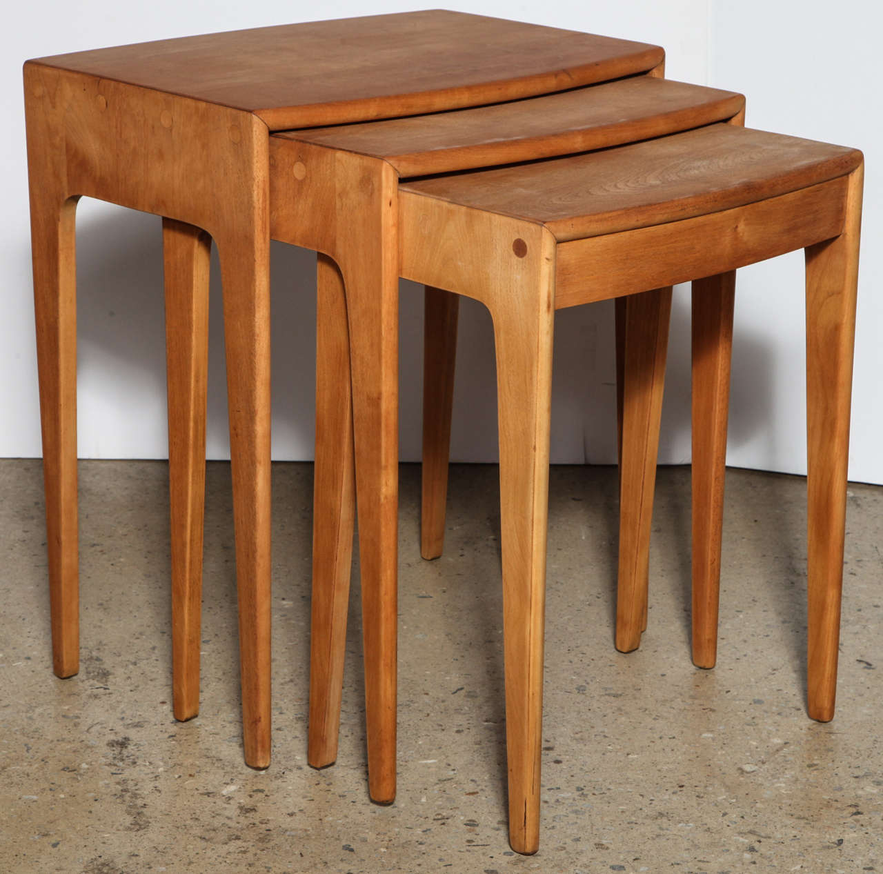 3 classic early 1950's Heywood Wakefield M312G Occasional Tables in solid Maple with round detail joints. The tables fit easily inside one another. Great as End Tables for entertaining or TV dinners. Fantastic utilitarian, multi-use Tables for small