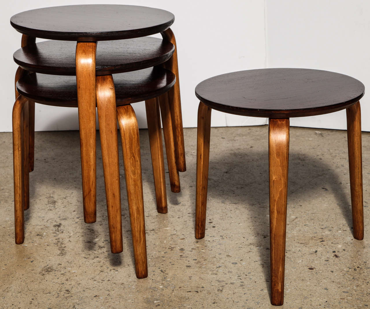 4 Mid Century Modern Stackable Tables with Mahogany Top on bent Birch legs.  Great for use as stacking Side Tables or Occasional Tables, stacking Stools or Coffee Table. Convenient use for compact, small space. Refinished