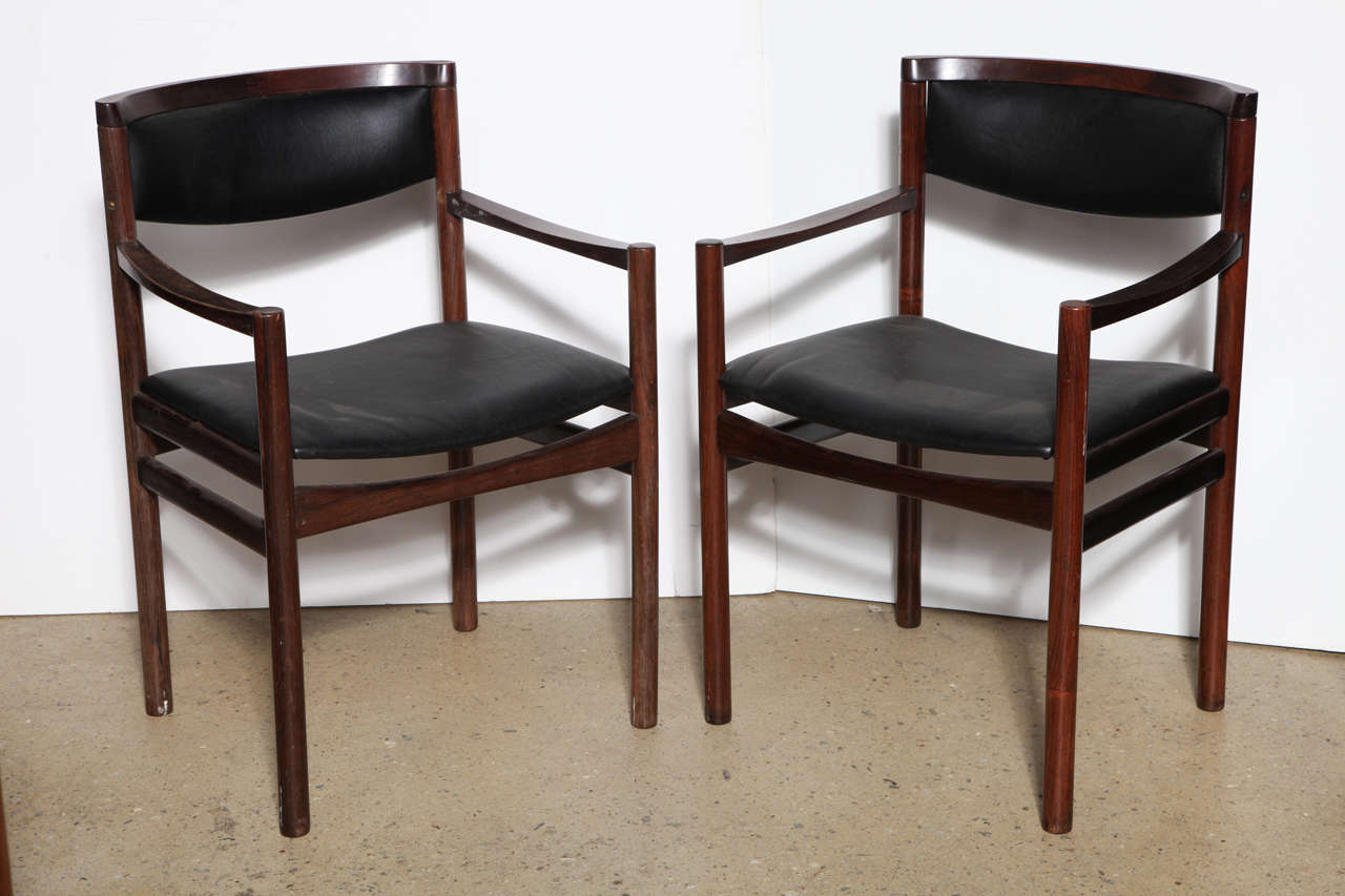 Pair of Danish Modern Danish Modern SAX Soro Stolefabrik Dark Brazilian Rosewood and Black Vinyl Chairs. Comfortable and beautifully grained Dark Brazilian Rosewood and Black Vinyl Armchairs. Stamped S.A.X. Made in Denmark. Set of Four matching side