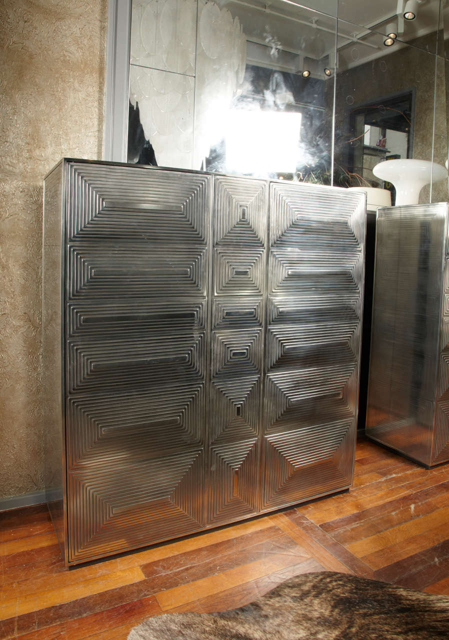 Pair of steel cabinets, opening by sculpted doors, inside shelves
Uniques and numbered pieces EB 1/2 and 2/2, by a French artist graduated from Ecole Boulle in 1995