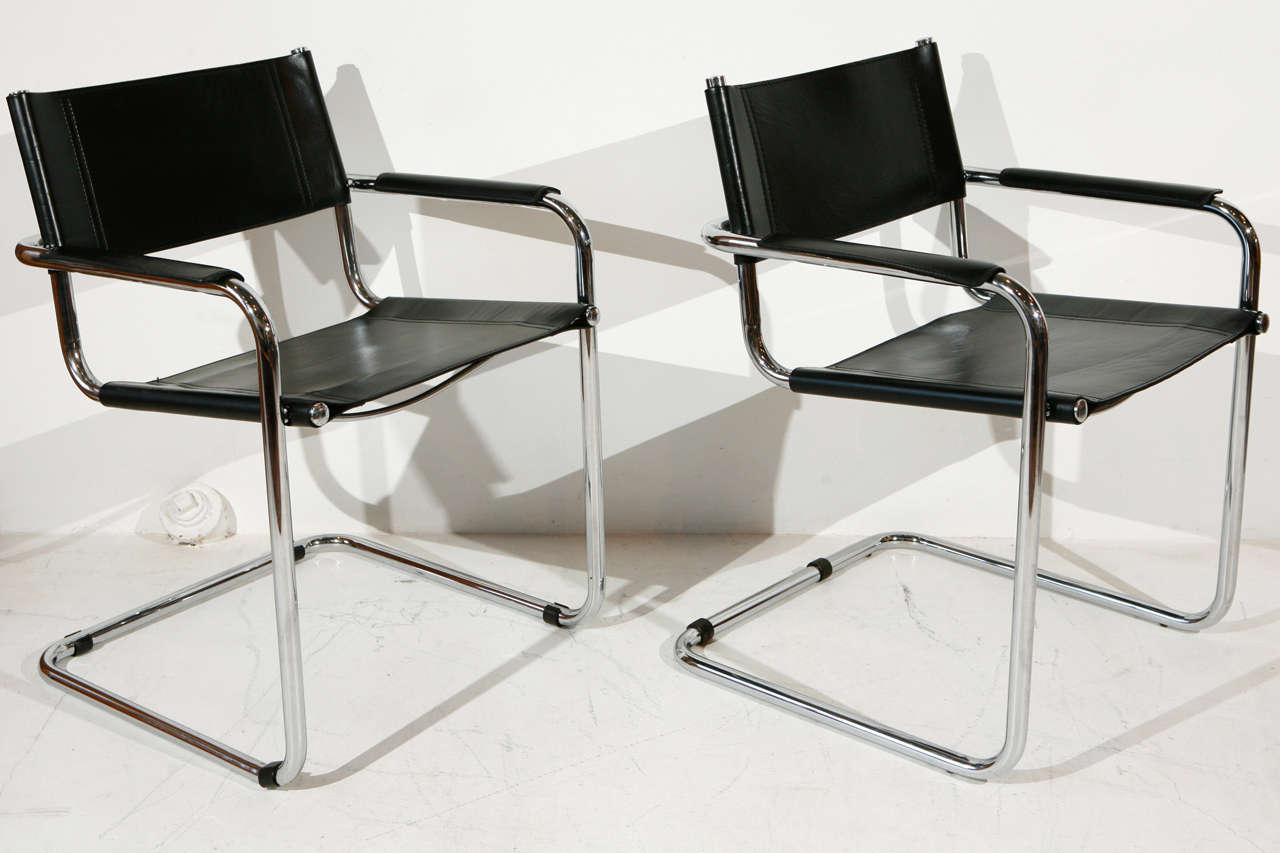 Steel and leather dining chairs in the Bauhaus style of Mart Stam, Marcel Breuer, Mies van der Rohe, and Matteo Grassi. Vintage. Leather recently restored.