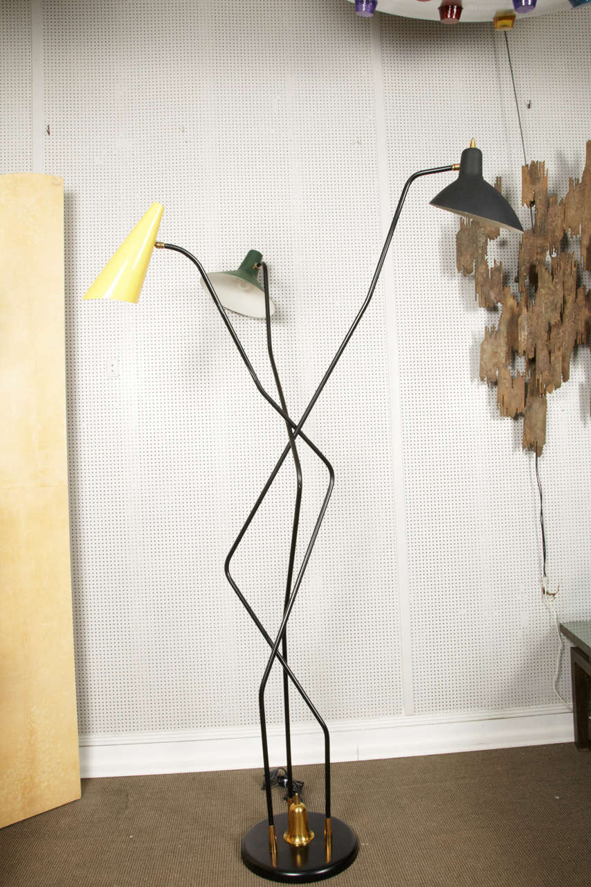 Great 1950s triennial floor lamp in the style of Stilnovo.
Italy