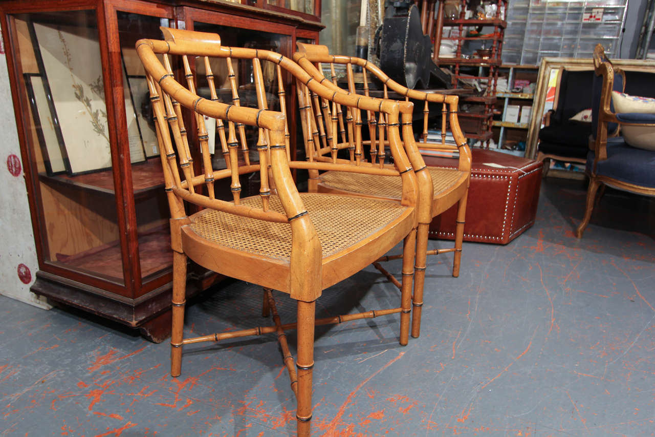 set of four faux bamboo chairs , caned seats, touches of black trim 
comfortable, very sturdy.  very handsome chairs