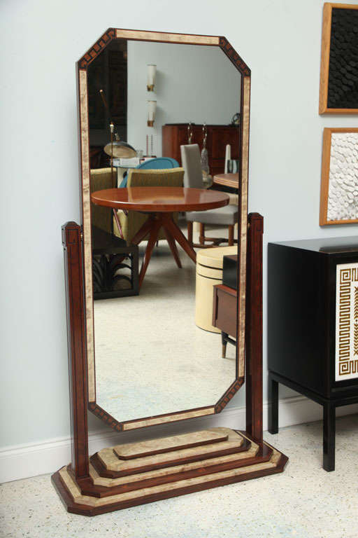 The octagonal mirror with shagreen and inlaid woods in geometric patterns above a stepped Stand with shagreen and wood.