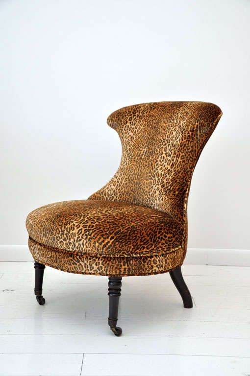 Petite Victorian slipper chair with velvet leopard fabric and front castors