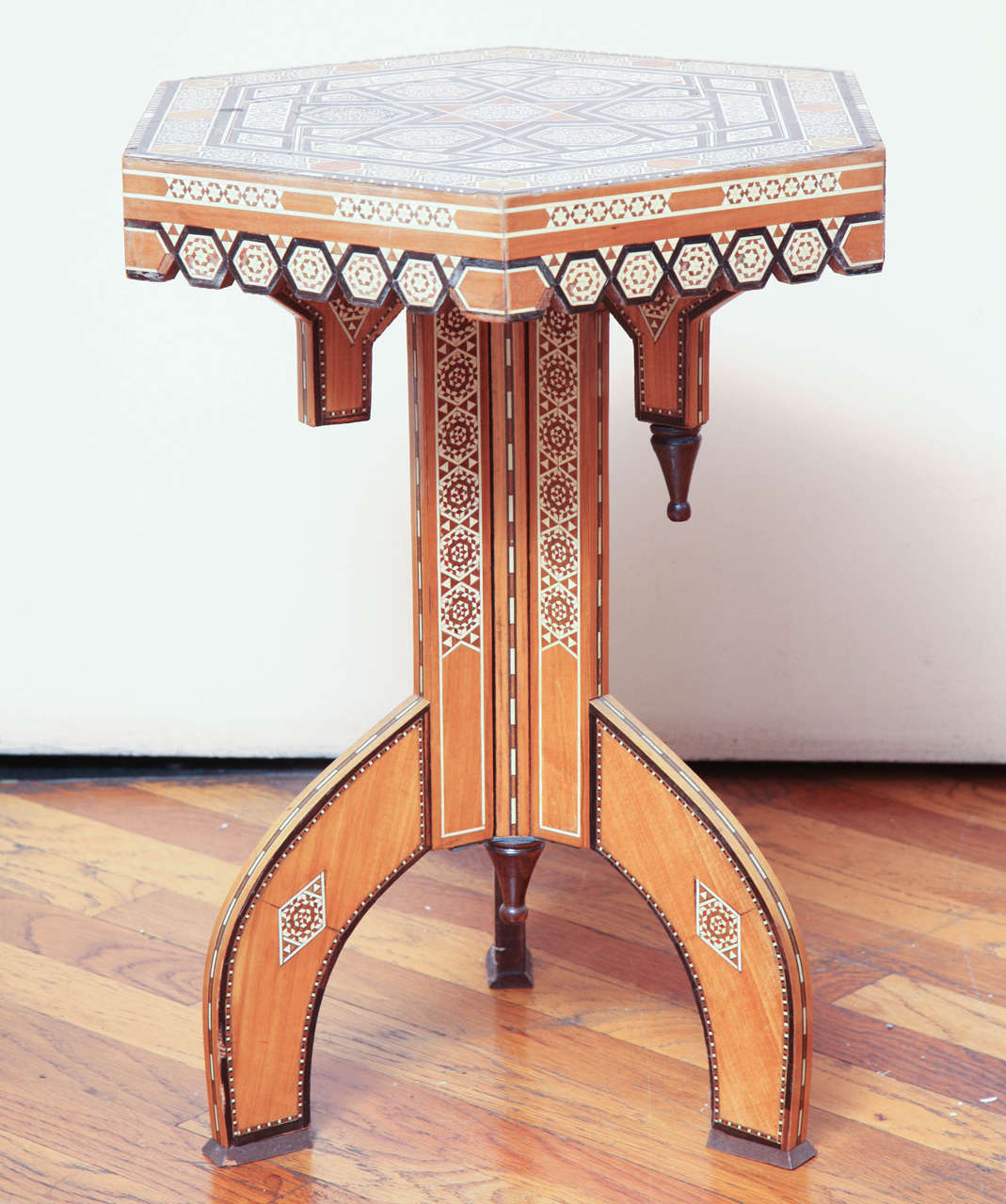 The top centered by a star, elaborately inlaid with mother-of-pearl, bone and ebony.