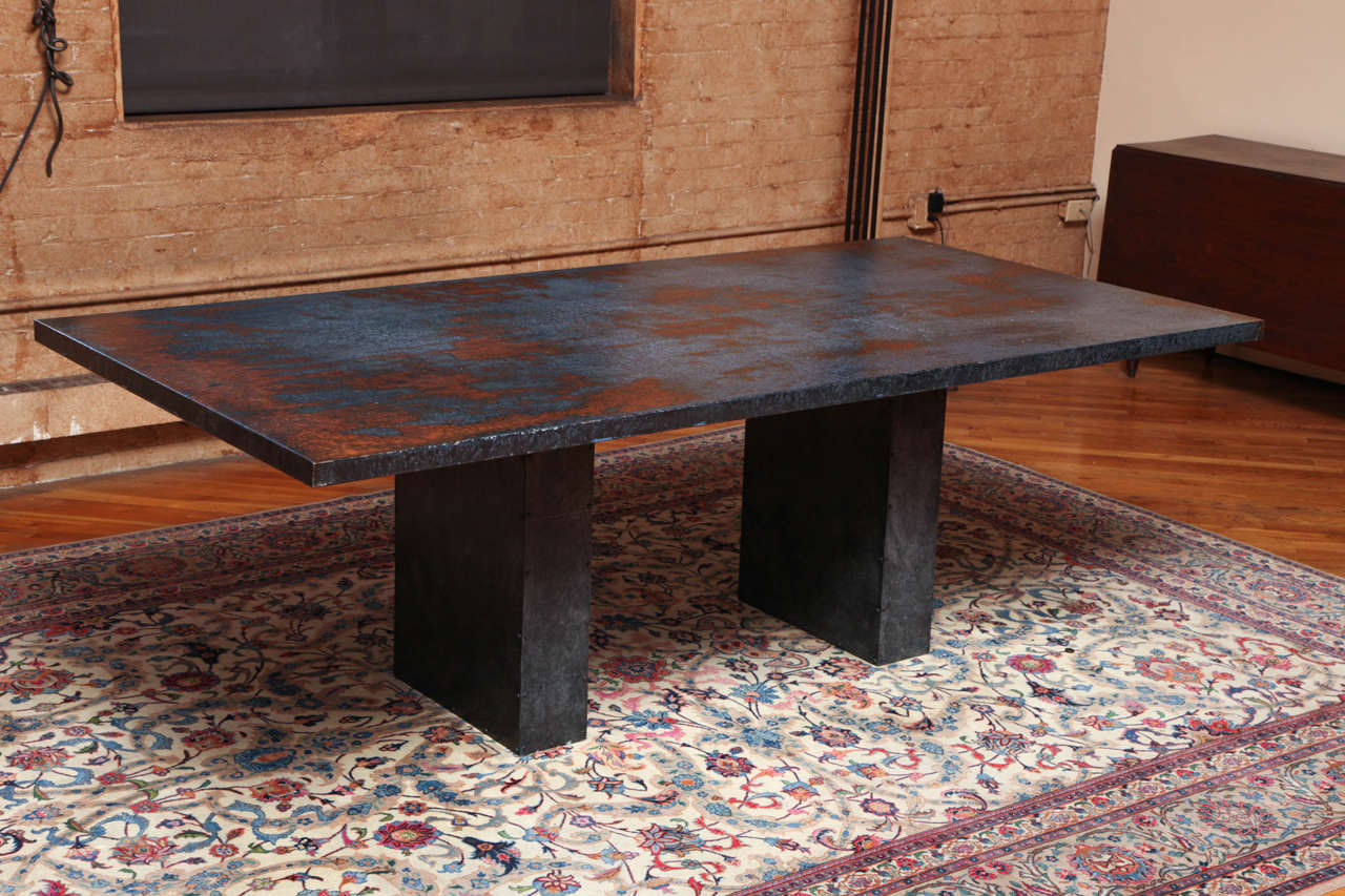 One of a kind table commissioned by a private collector.  The rectangular patinated top on two block-form pedestals with attractive rivets.

Free delivery within Manhattan offered until November 10.