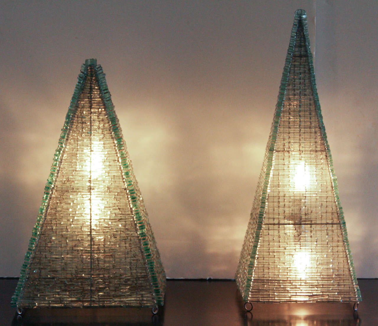 France circa 1950s pair of large glass pyramid sculptures wired as lamps. Sold individually.