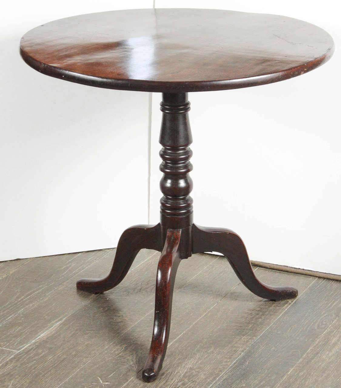 An English, circa 1880 mahogany tilt-top table with tripod base.