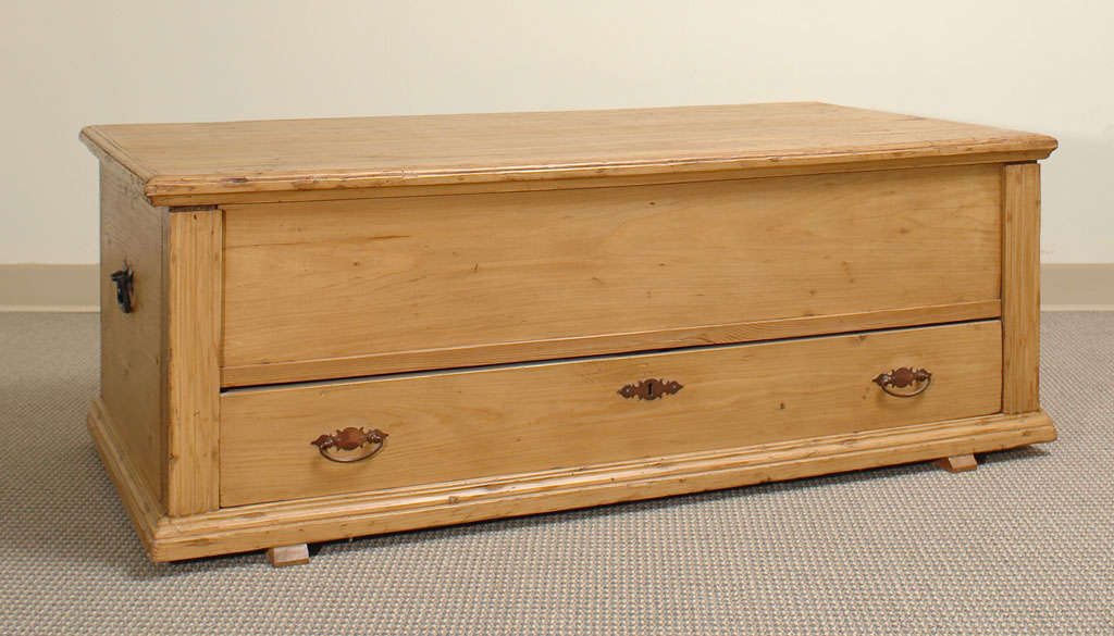A most useful mule chest, reduced in height at some point by cutting down beneath the lid. The four sides are mortice and tenon jointed into corner stiles of chestnut, the fronts covered by fluted molding. A single dovetailed drawer sits above base