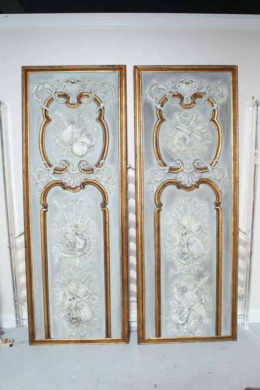 Stunning pair of Boiserie Panels.  Hand carved with gesso and gilt with musical motif.