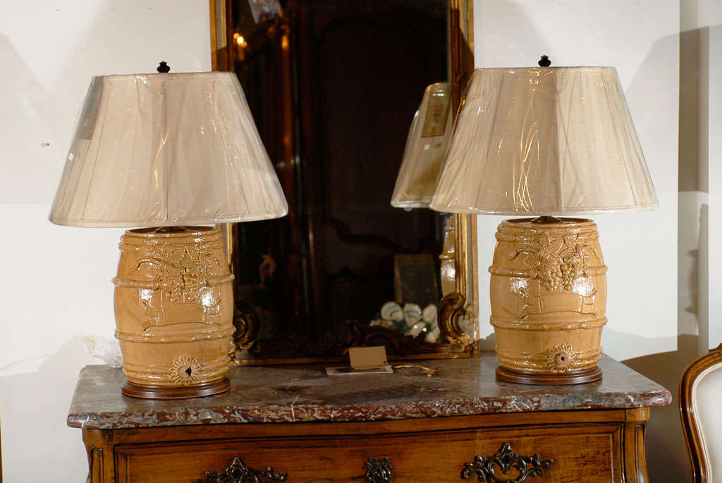 Pair of 19th Century Spirit Barrels Mounted as Lamps with Linen Lampshades. These are One of a Kind Items. Please Refer to Our Website for our Complete Lamp Selection. jadamsantiques.com