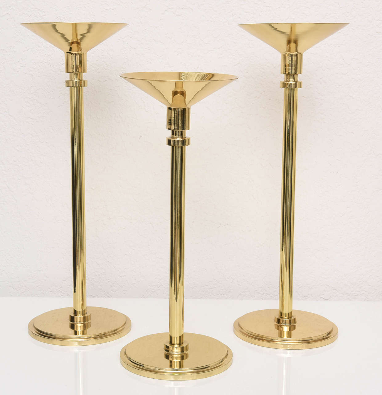 American Set of Three Art Deco Style, Graduated-Height, Polished Brass Candlesticks