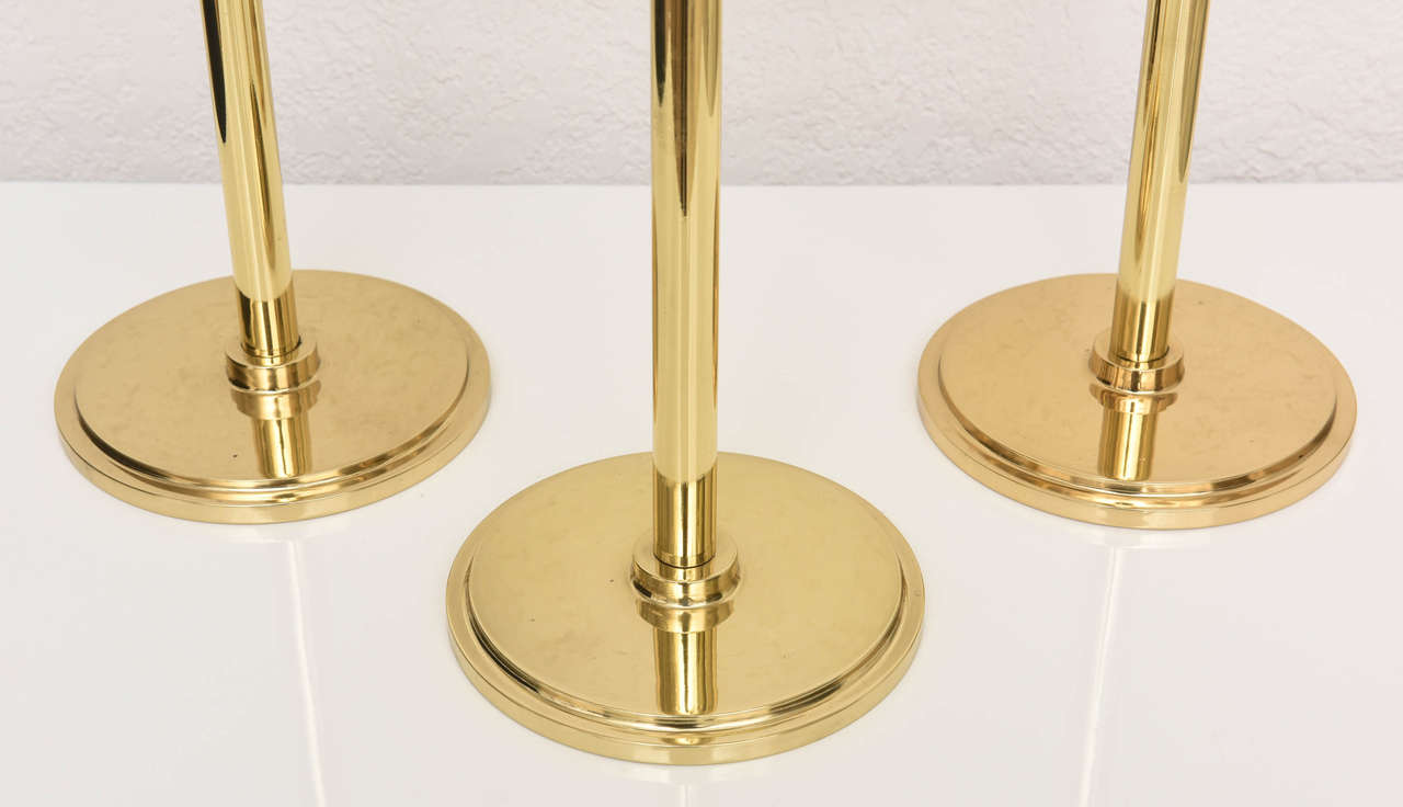 20th Century Set of Three Art Deco Style, Graduated-Height, Polished Brass Candlesticks