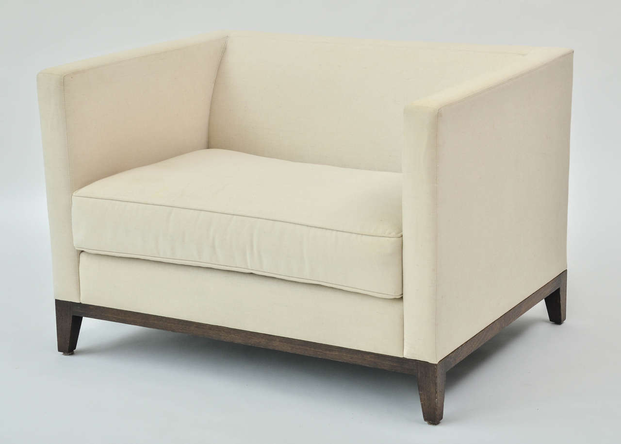 Pair of Christian liaigre armchairs upholstered in a cream linen fabric.
Elegant and minimal.
