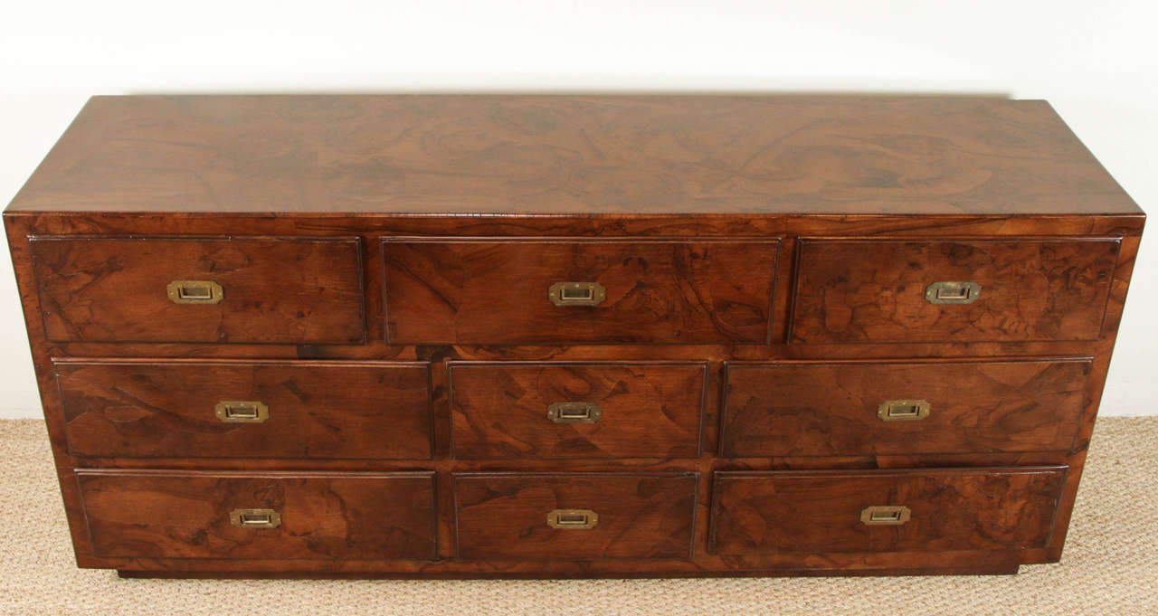 Stained olive burl wood dresser with Campaign style hardware. 
Nine drawers with restored dark stain.