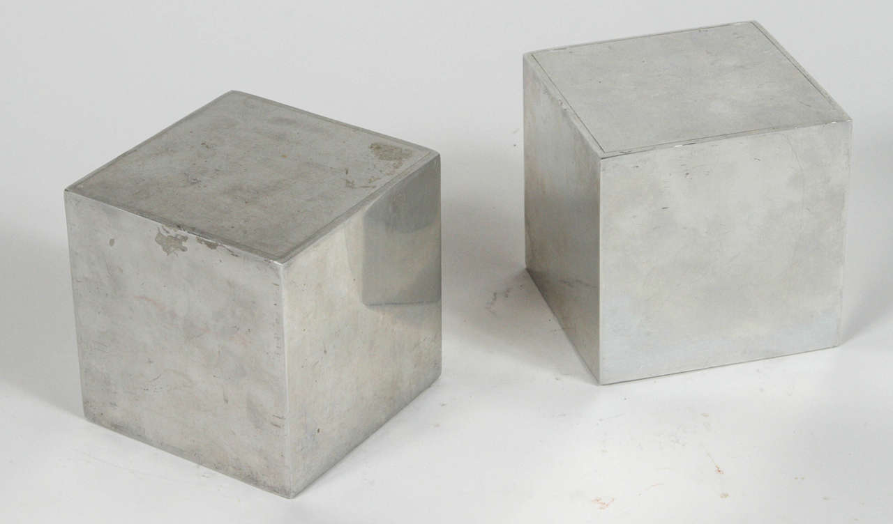Cube bookends by Design Line.

Sheet aluminum with weighted sand,

circa 1955. 

  