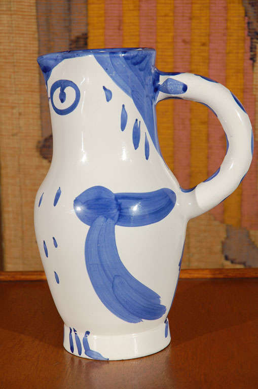 Glazed pitcher painted blue, 1954 , titeled Owl , edition of 500, Madoura plein feu and signed Picasso as shows in pictures.