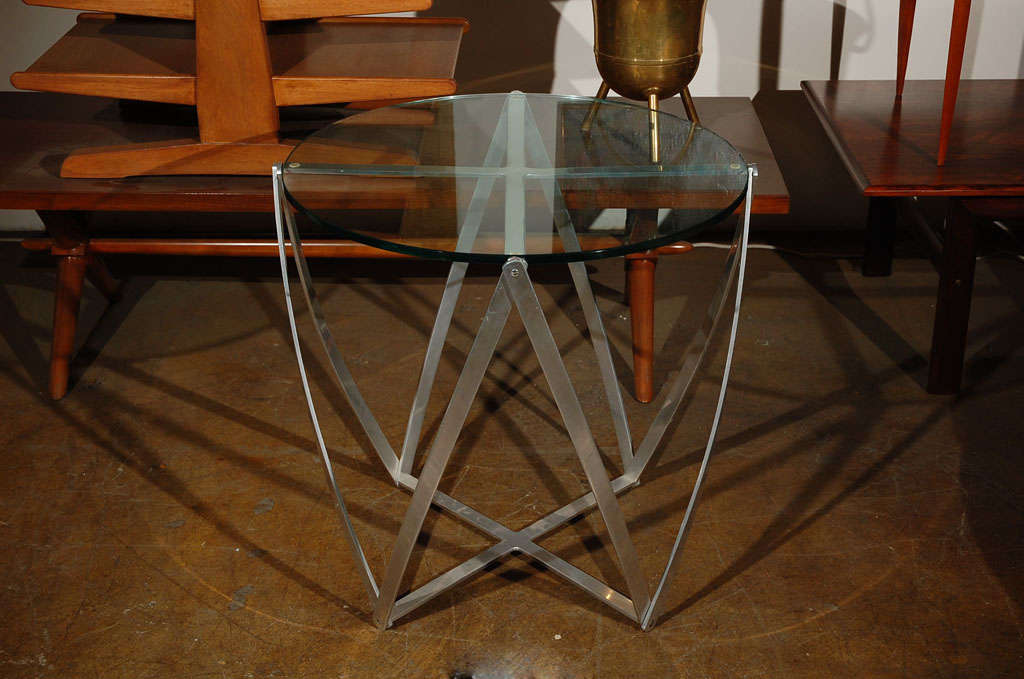 Very nice and rare side table in polished aluminum, by John Vesey.