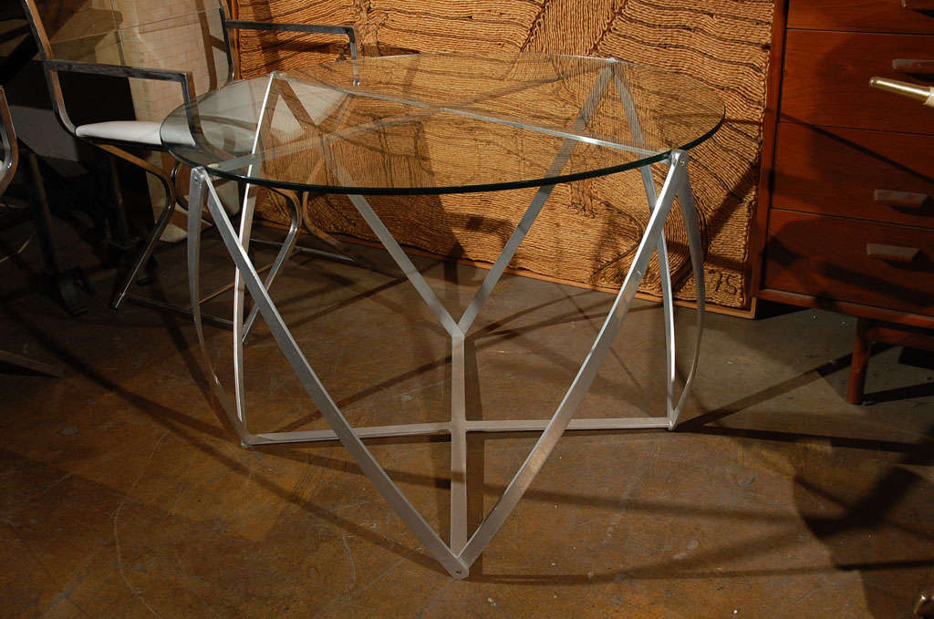 This an other size of the well known John Vesey side table  in aluminum and glass.