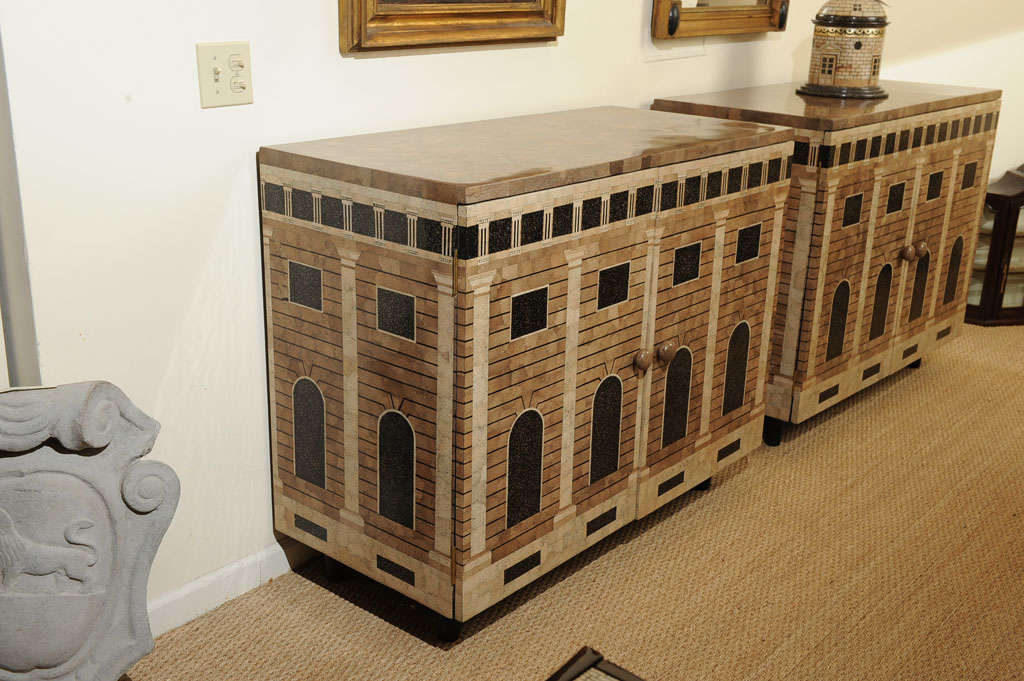 A Fornasetti style 2-door lacquered cabinet with architectural design