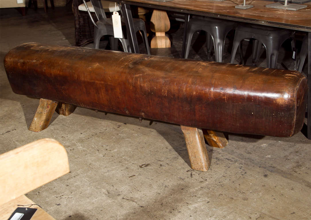 Belgian leather pommel horse from a gymnasium the legs now cut down to seating height makes a great seating bench or at the foot of a bed.