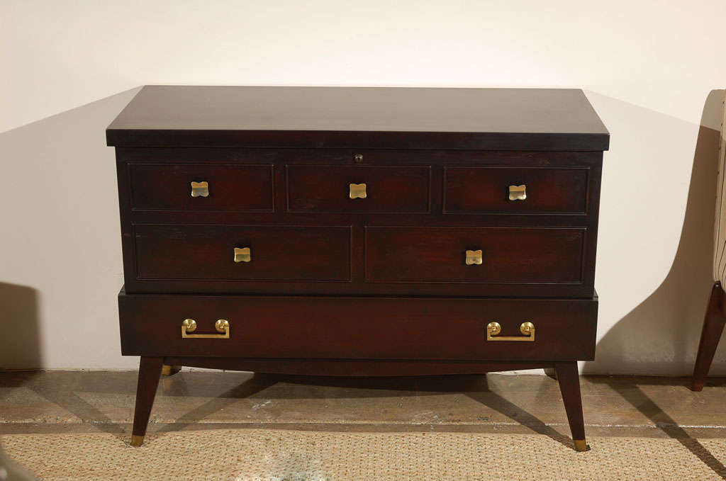 A beautiful mid-century cedar chest from Lane, the top opens to access the cedar trunk and there's a functioning drawer on the bottom, as well. Excellent for storage of linens and the like, this chest is incredibly versatile and would make a great