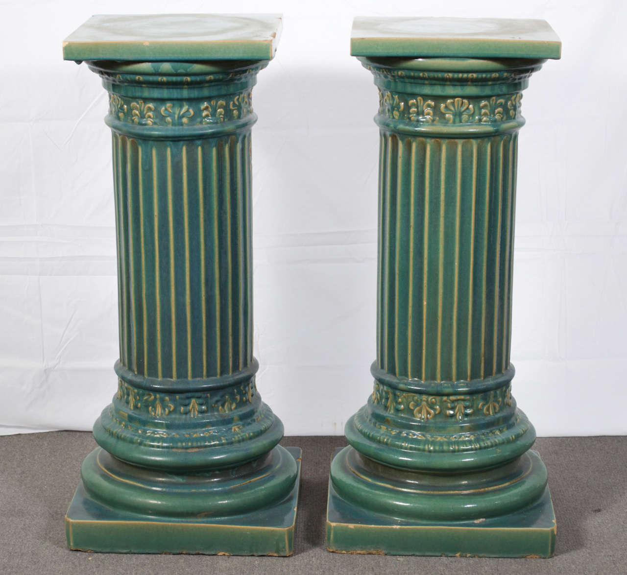 A pair of early 20th century doric style columns, in Aqua Green, by Gladding McBean. Gladding McBean was well known for producing some of the most amazing pottery and architectural elements at the time... the golden age of California art pottery. 